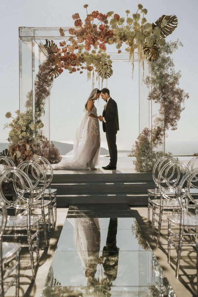 Our Plexiglass Wedding Gazebo features clear panels and sleek lines, creating a modern, elegant centerpiece. Its transparent design allows natural light to enhance your ceremony, blending seamlessly with any setting and adding a contemporary touch to your special day.