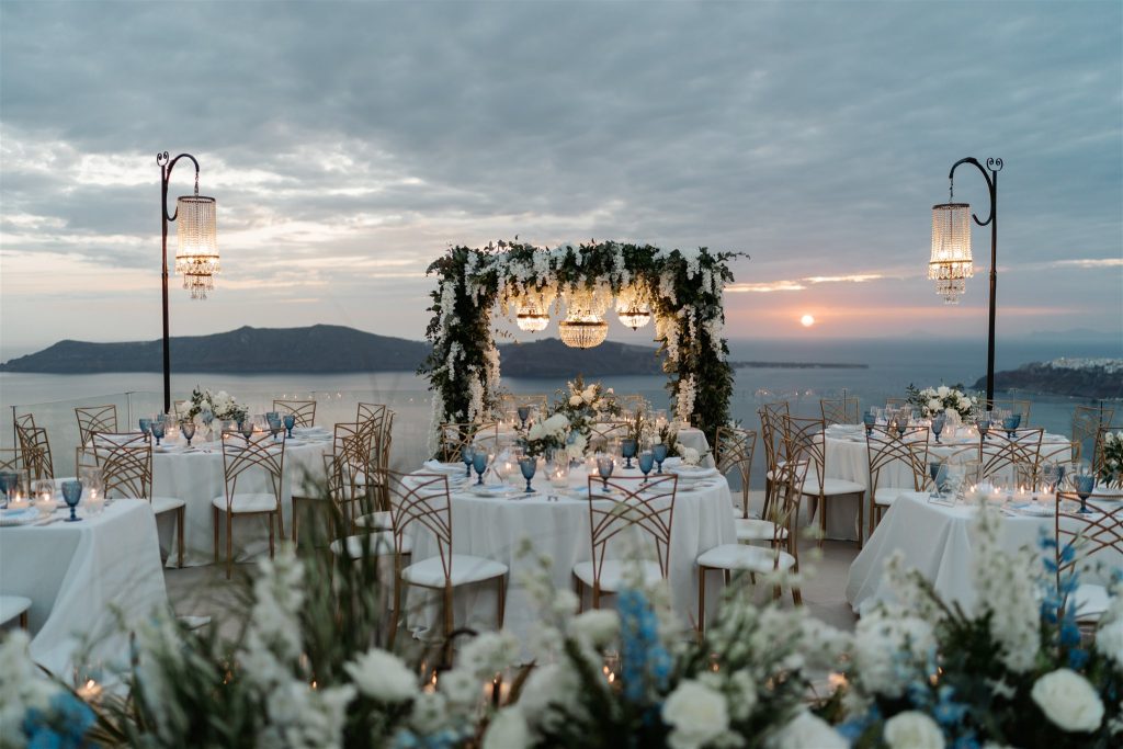 Beneath a splendid canopy, crystal chandeliers twinkle like stars, casting a gentle glow on floral adornments. Fragrant blooms perfume the air, fashioning a tranquil haven of grace and allure.